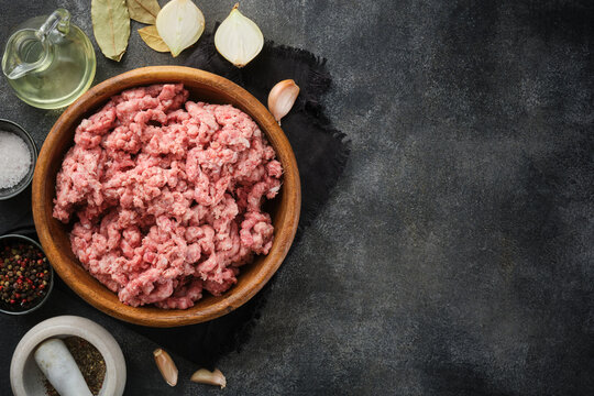 Raw minced pork. Raw minced meat in bowl. Fresh pork minced meat.