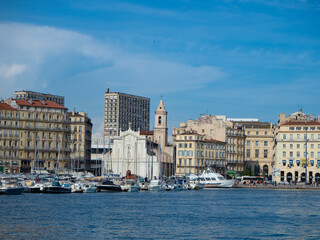 Marseille, France - May 15th 2022: Crossing the old harbour in front of Eglise Saint-Ferreol les Augustins
