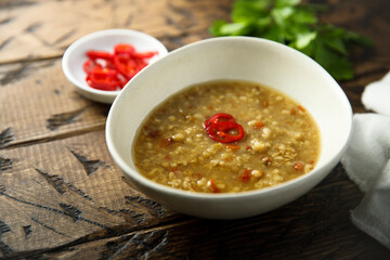 Traditional homemade lentil soup with chili pepper