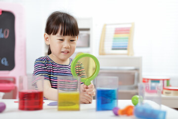 young  girl  play science experiments for homeschooling