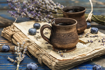The concept of rustic style tea. Lavender flowers and blueberries. Vintage book