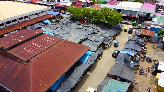 Orbital drone shot of a market in the town