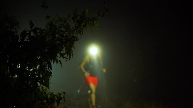 Solo trail runner at night