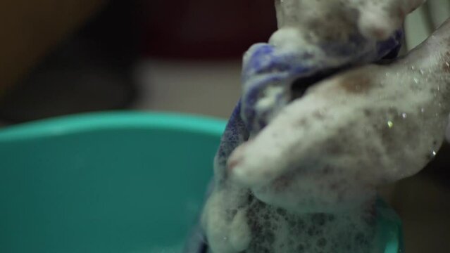 close up shot of hand washing clothes
