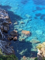 Naklejka na ściany i meble Blue sea water in the sunny day in a coast