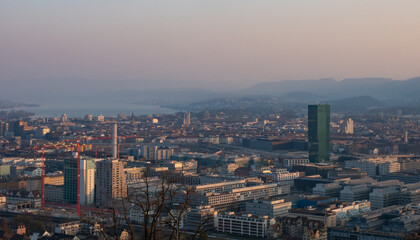 Fototapeta na wymiar Zurich, Switzerland - March 26th 2022: Panoramic view over the city from the famous viewpoint Waid.