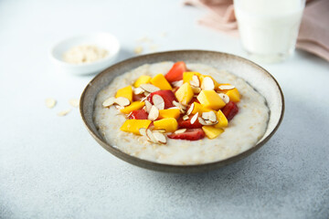 Homemade oatmeal porridge with strawberry and mango