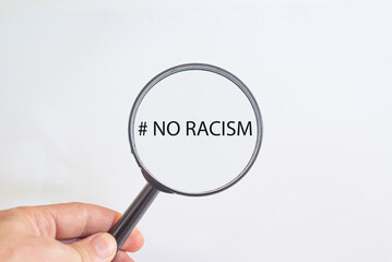 No to racism text in magnifying glass. awareness idea concept.