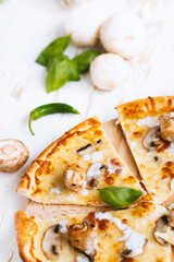 Tasty fresh baked pizza with champignons and chicken fillet