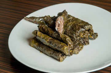 Pile of dolma - stuffed grape leaves with minced meat