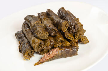 Pile of dolma - stuffed grape leaves with minced meat