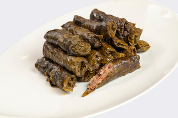 Pile of dolma - stuffed grape leaves with minced meat