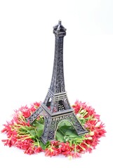 Fototapeta na wymiar Eiffel Tower toy on Combretum indicum 