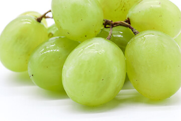 bunch of green grapes on white background