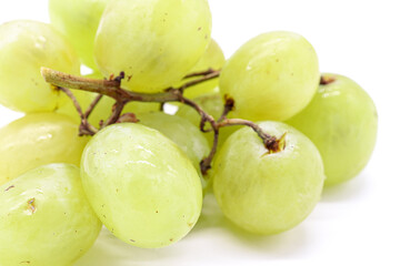bunch of green grapes on white background