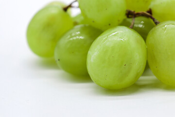 bunch of green grapes on white background