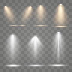 Set of golden spotlight isolated on transparent background. Glowing light effect with gold rays and beams. Scene floodlight spotlight stage beam.