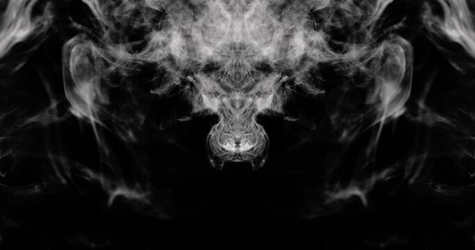 Close-up of wispy mirrored smoke filling the top of the frame and swirling around the edges creating interesting shapes.