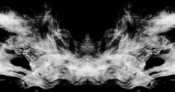 Close-up of mirrored smoke as it drifts towards the bottom and sides of the frame creating unique shapes and patterns as it moves.