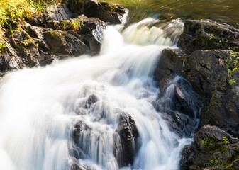 Fototapeta na wymiar Maine waterfall running fast enough for motion blur