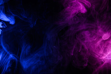 Flowing clouds of blue and purple neon smoke dark abstract background