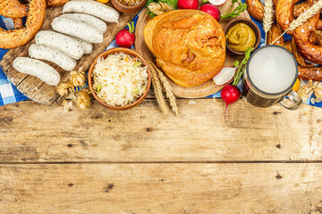 Traditional Oktoberfest set. Pretzels, beer, weisswurst, smoked pork knuckle eisbein with cabbage