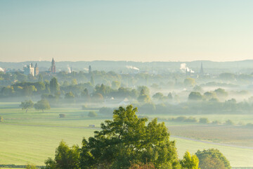 A view over a valley in the rolling hill landscape outside Maastricht, where the valley is covered...
