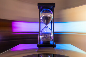Hourglass moving fast light background.