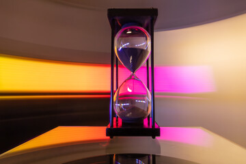 Hourglass moving fast light background.