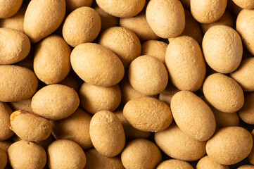 Soy-covered Peanuts with sauce texture background, traditional turkish coated nut 