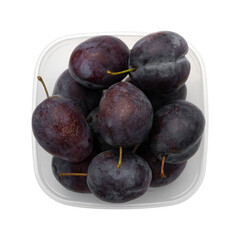 fresh ripe purple plums in plastic food box isolated on white background, top view
