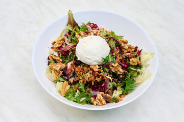 salad with bacon, fried onion, walnuts, goat cheese and raspberry vinegar