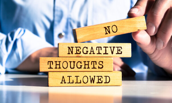 Wooden blocks with words 'No Negative Thoughts Allowed'.