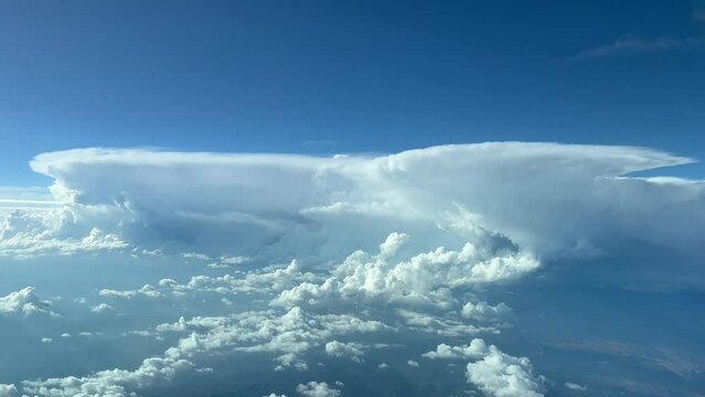 Impressive aerial view from a cockpit jet at cruise level of a threatening line of cumulonimbus ahead. Pilot point of view. 4k 60fps.