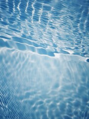 Bluewater waves on the surface ripples blurred. Defocus blurred transparent blue colored clear calm water surface texture with splash and bubbles. Water waves with shining pattern texture background.