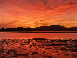 Fototapeta na wymiar Dramatic deep colours of brilliant sunrise