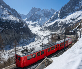 Montenvers train (cogwheel train) with Les Grandes Jorasses peaks and Mer de Glace glacier. View of Vallee Blanche (winter ski resort) of the Mont Blanc massif, Alps, Haute-Savoie, France - 532737008