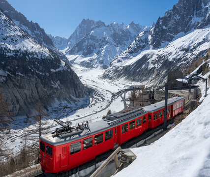 Montenvers train (cogwheel train) with Les Grandes Jorasses peaks and Mer de Glace glacier. View of Vallee Blanche (winter ski resort) of the Mont Blanc massif, Alps, Haute-Savoie, France