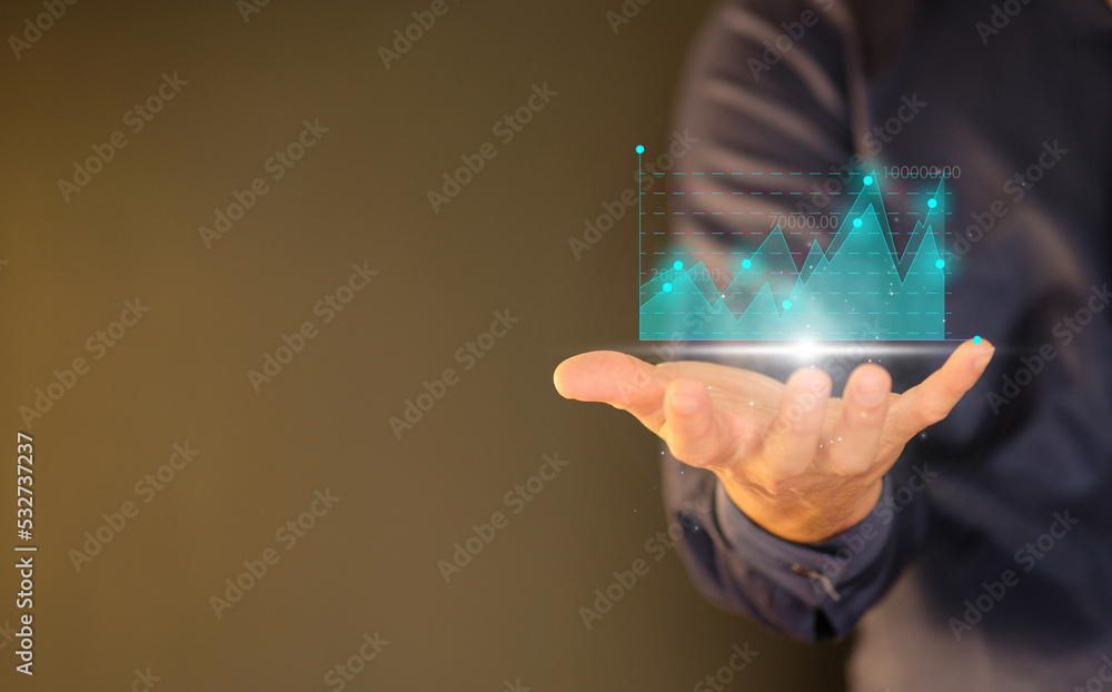 Poster businessman holding graph with analyze sales data and an economic graph chart in order to restart bu