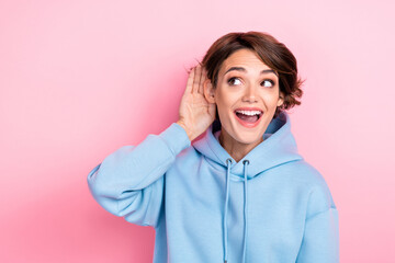 Closeup photo of young attractive gorgeous nice woman wear blue hoodie touch ear curious interested...