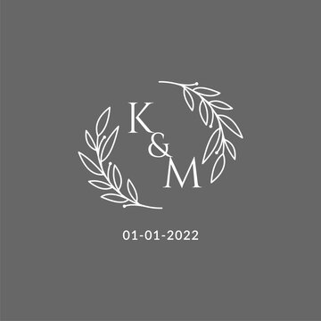 Initial letter KM monogram wedding logo with creative leaves decoration