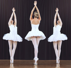 Abstract dance performance by ballet team performing creative dancing routine on theater stage. Partnership, teamwork and dancer or prima ballerina women or working together on recital show © Jade M/peopleimages.com