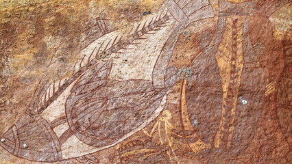 Aboriginal rock art: fishes -barramundi-cat-mullet- in red-brown tones and X-ray style. Ubirr-Kakadu-Australia-186