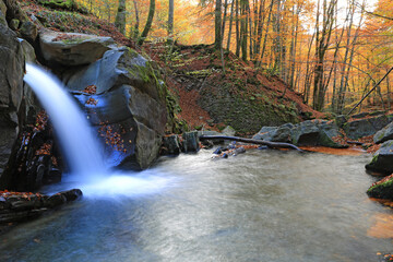 nice waterfall oin autumn forest