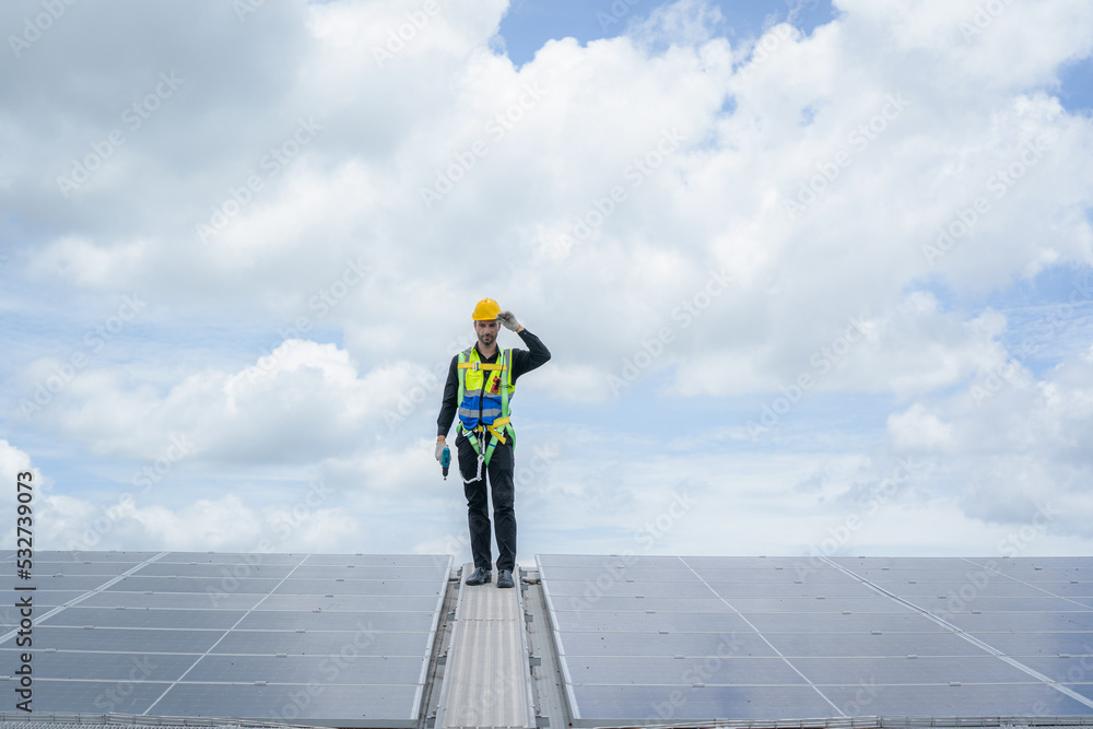 Poster professional worker installing and checking solar panels on the roof of a factory,innovative solutio
