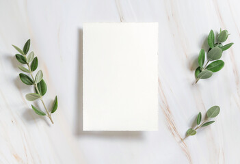 Vertical card on a marble table decorated with eucalyptus branches top view, Wedding mockup