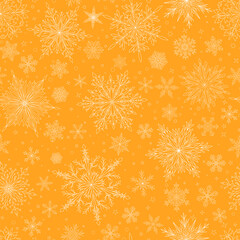 Seamless pattern with complex big and small Christmas snowflakes in yellow colors. Winter background with falling snow