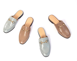 Stylish light blue and beige loafers stand in a row. Fashionable and stylish shoes and beautiful shoes.