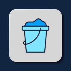 Filled outline Sand in bucket icon isolated on blue background. Plastic kid toy. Summer icon. Vector