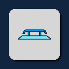 Filled outline Skateboard stairs with rail icon isolated on blue background. Vector